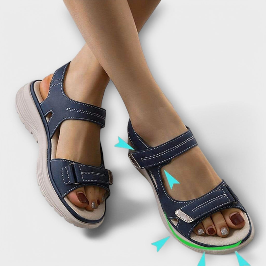 Comfortable women's orthopedic sandals with strong arch support & adjustable straps for daily wear & foot health.