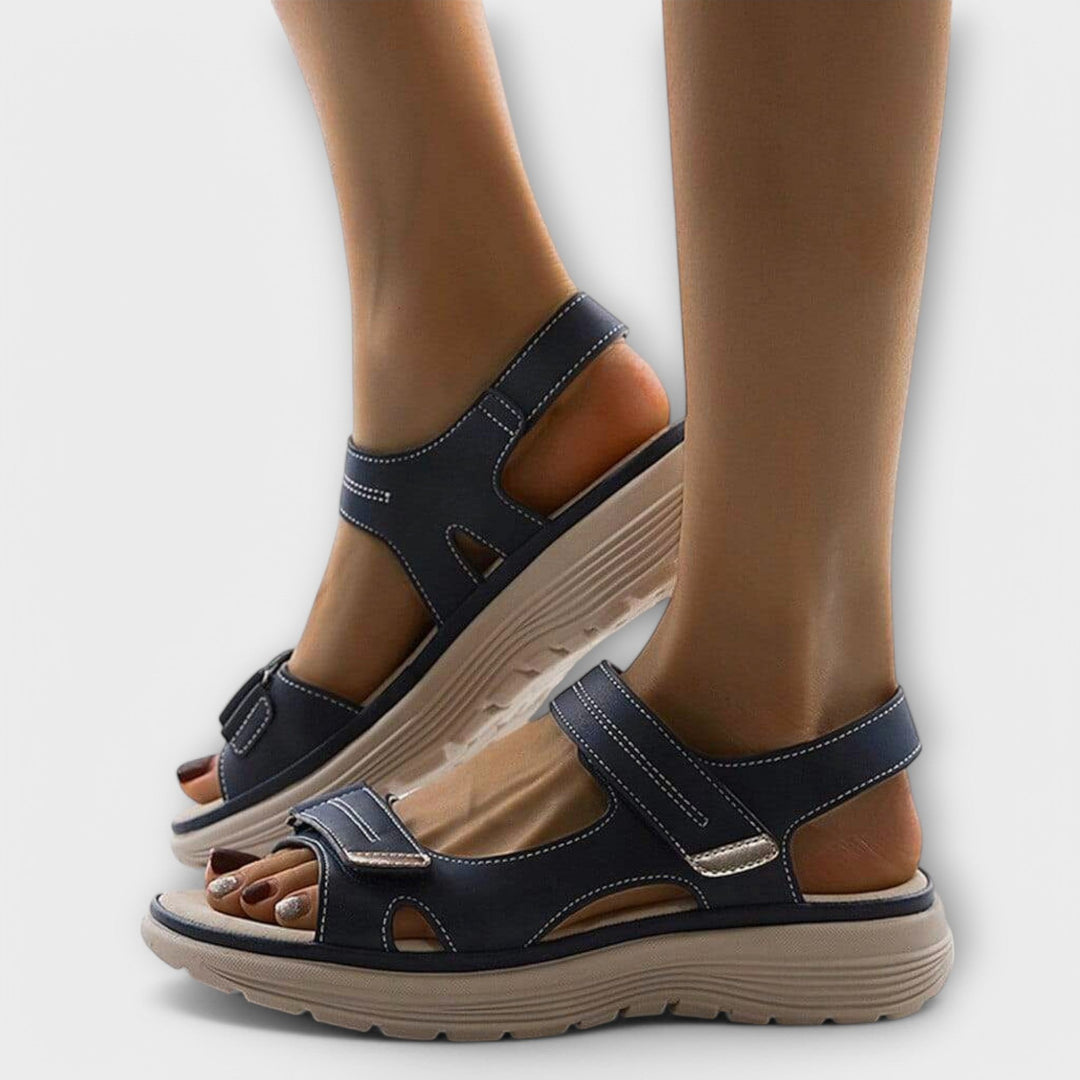 Stylish women's walking sandals: open toe, flat design, adjustable straps & orthopedic arch support for comfort.