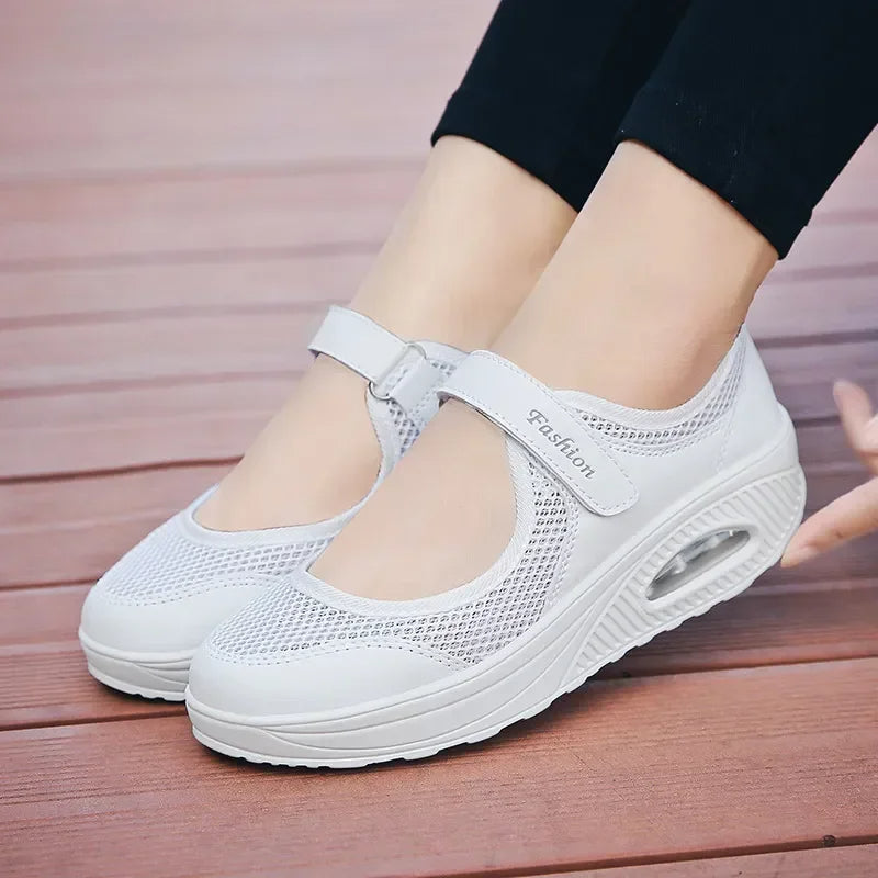 Lightweight mesh slip-on orthopedic shoes for women, providing foot support & breathable comfort.