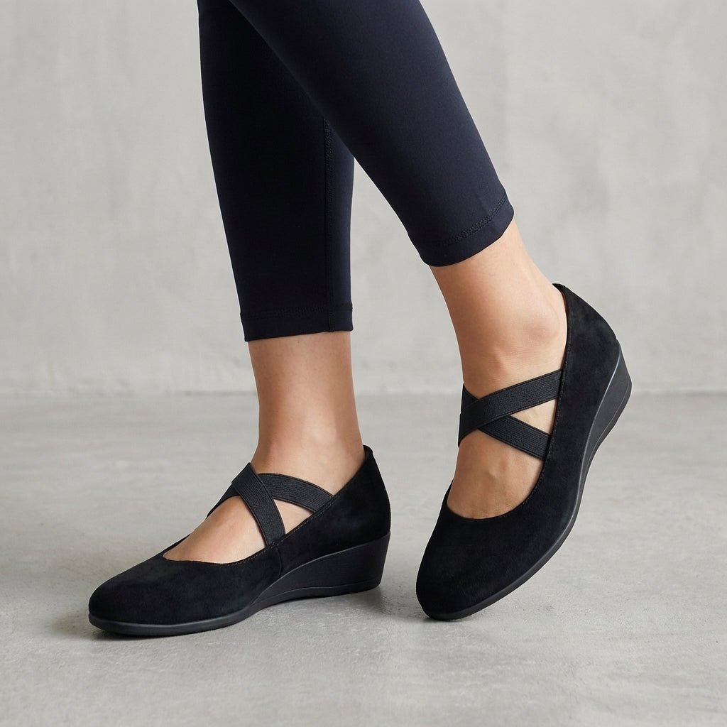 Women's orthopedic wedge flats with criss-cross straps, offering all-day comfort and arch support.