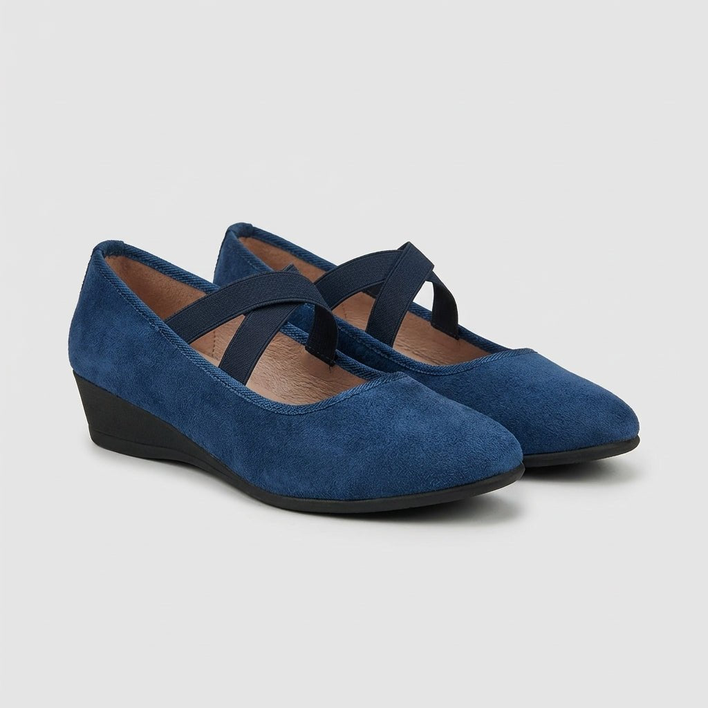 Women's orthopedic slip-on wedge flats with criss-cross design for superior all-day comfort and support.