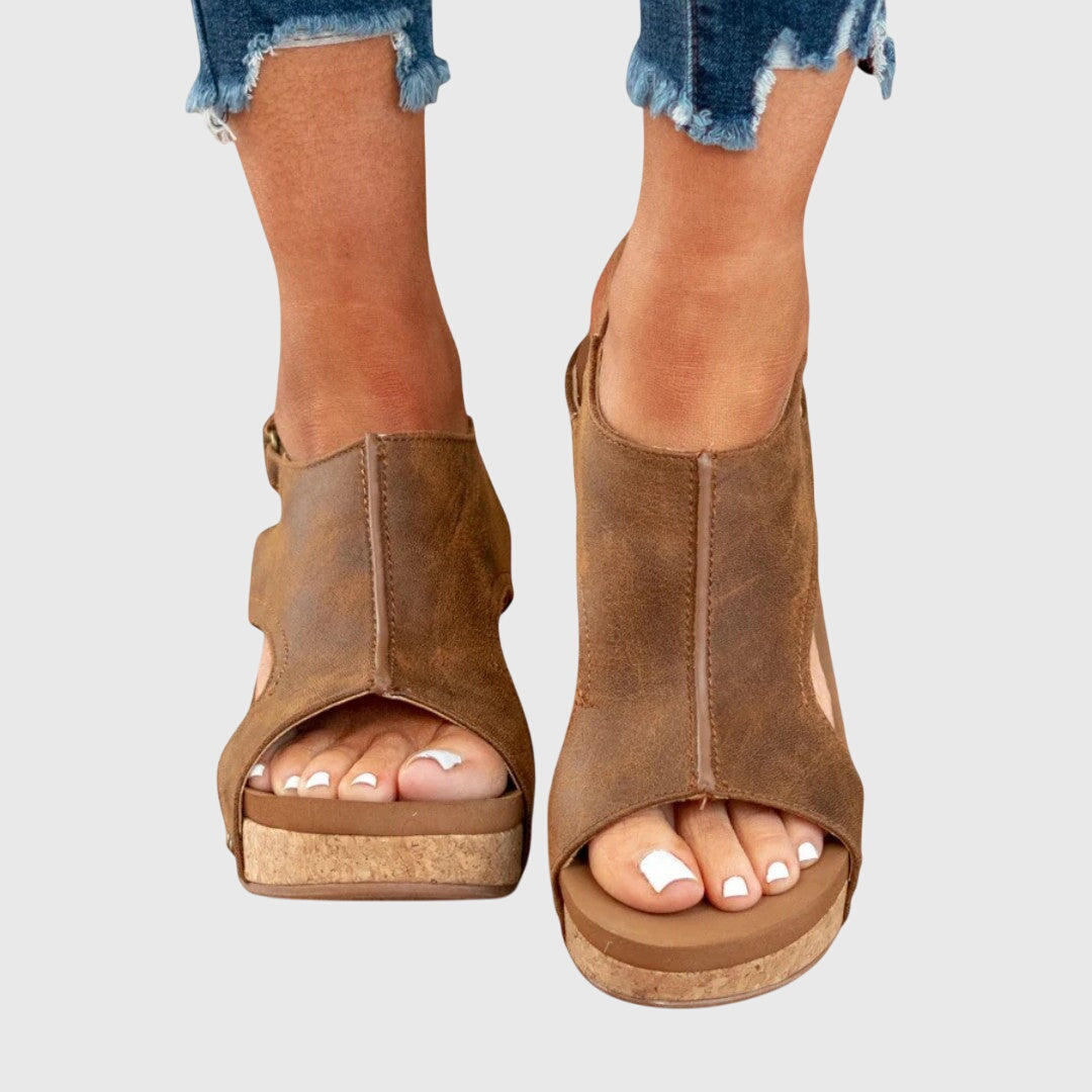 Casual women's open-toe sandals featuring a comfortable wedge heel. Supportive footwear for summer walking.