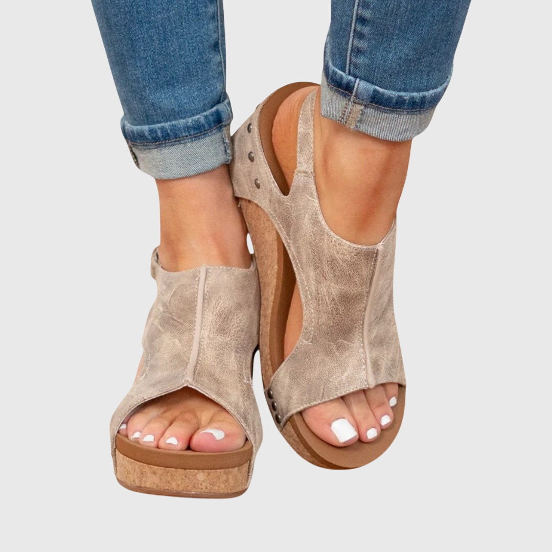 Close-up of comfortable women's orthopedic wedge sandals. Everyday style with arch support for walking.