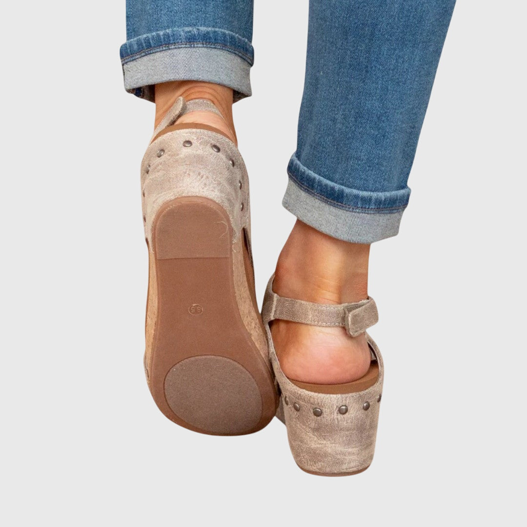 Woman wearing versatile orthopedic wedge sandals. Enjoy everyday comfort and style for summer casual walking.