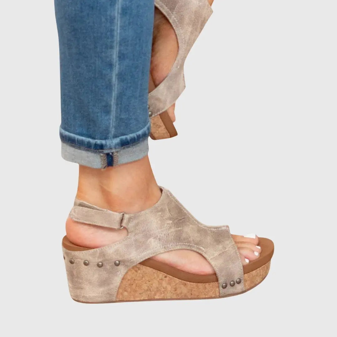 Supportive orthopedic women's wedge sandals with a comfortable platform and secure slingback strap.