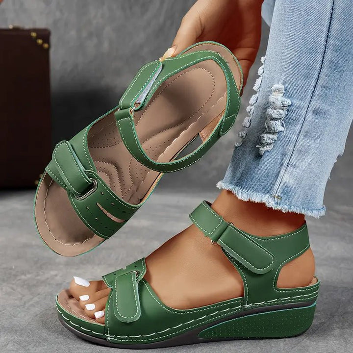 Stylish women's summer wedge sandals with orthopedic arch support and adjustable design for comfort.