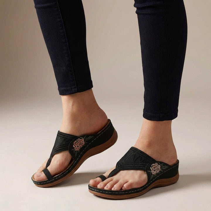 Comfortable thong wedge sandals for women, featuring intricate floral embroidery and orthopedic support.