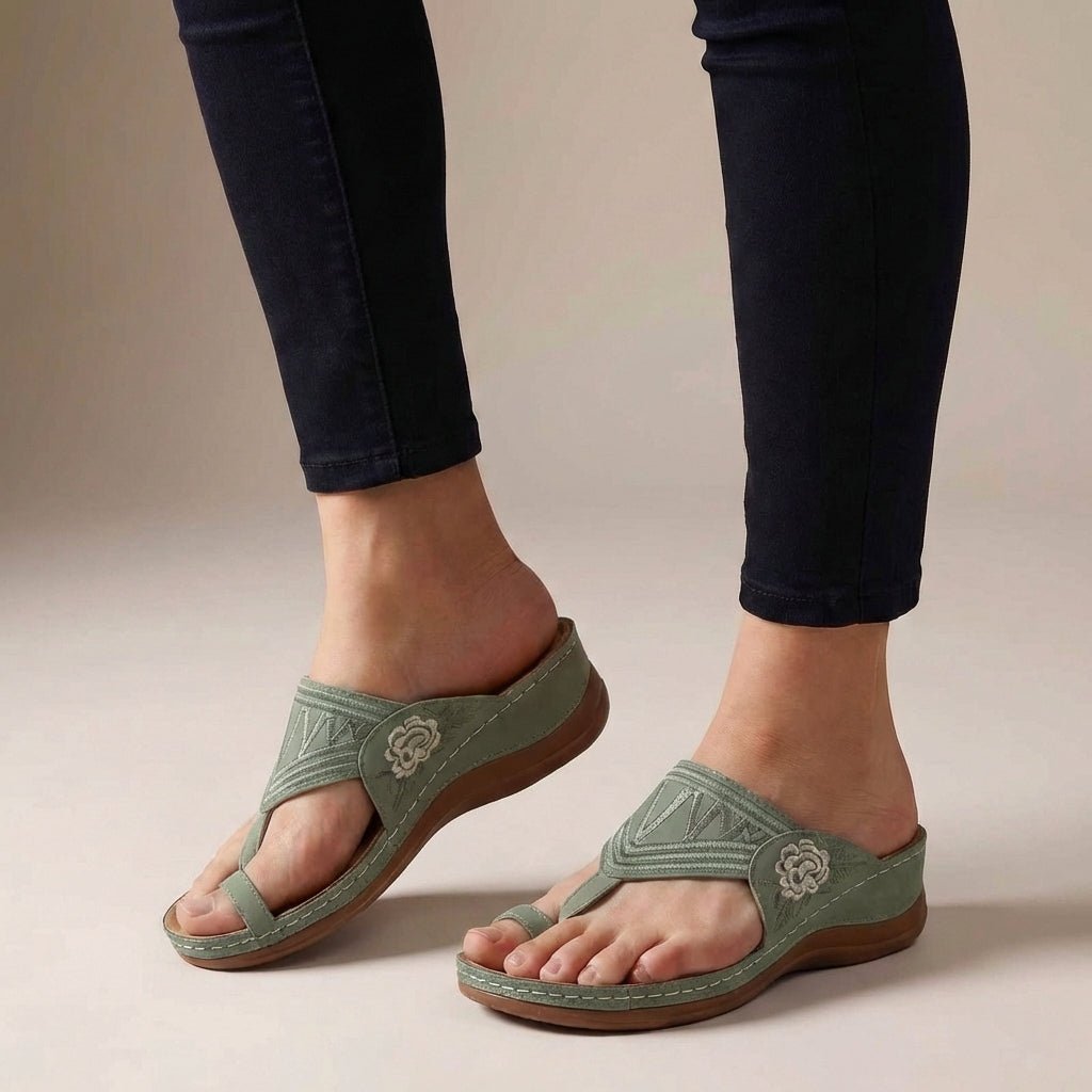 Elegant floral embroidered thong sandals for women, offering a comfortable wedge heel and arch support.