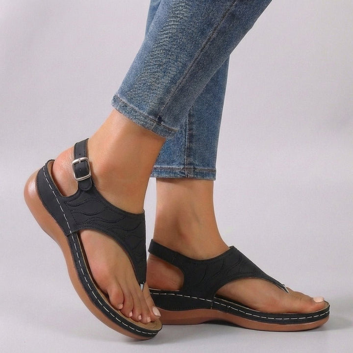 Elegant women's open-toe wedge sandals with embroidered ankle strap, designed for stylish summer comfort and support.
