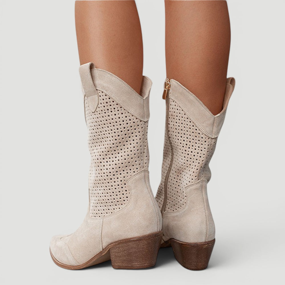 Stylish women's western cowboy boots. Fashionable mid-calf design with orthopedic comfort and versatile wear.