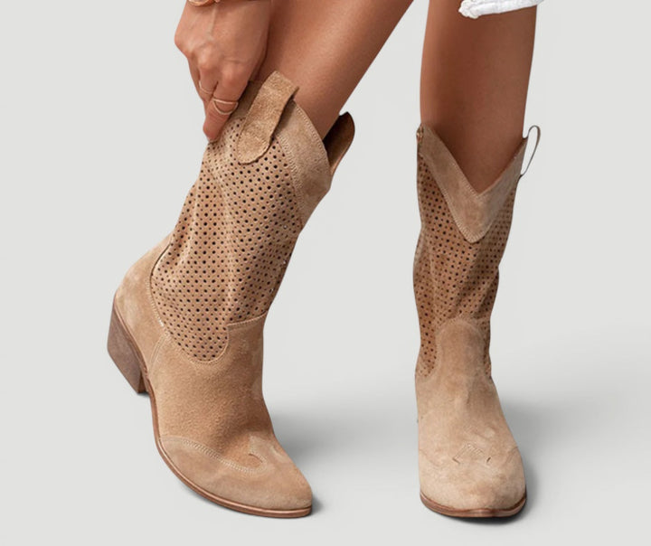Fashionable mid-calf women's orthopedic western boots. Providing stylish comfort for versatile casual outfits.
