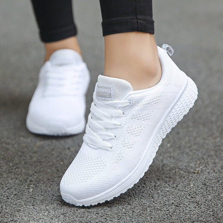 Women's orthopedic wide-fit walking trainers with arch support for comfort.
