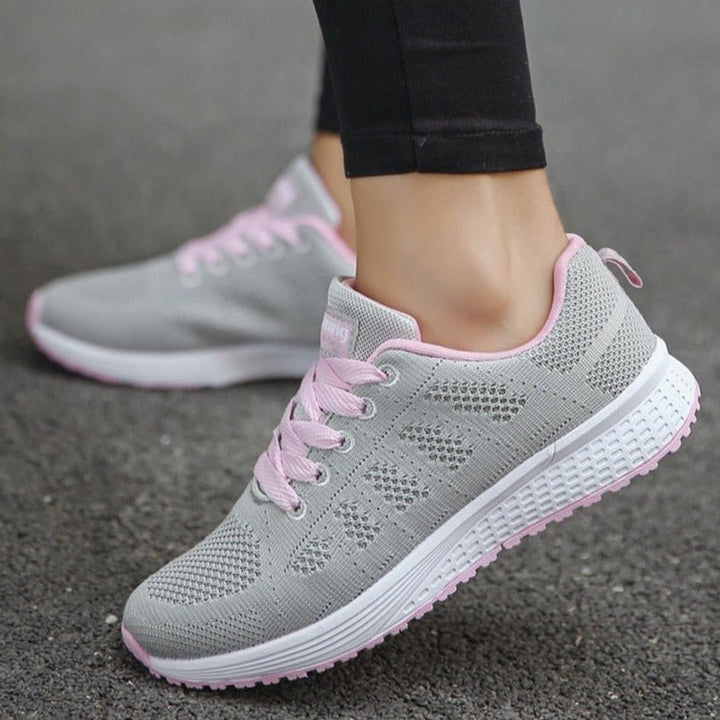 Wide-fit women's walking trainers with superior arch and orthopedic foot support.