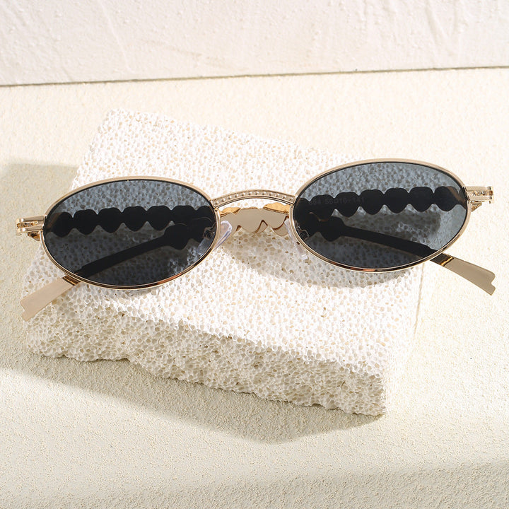 Fashion-forward women's oval sunglasses, a luxurious summer essential with excellent UV protection & stylish frames.