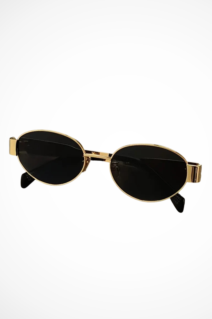 Stylish women's oval metal frame sunglasses, providing UV protection with a chic design.