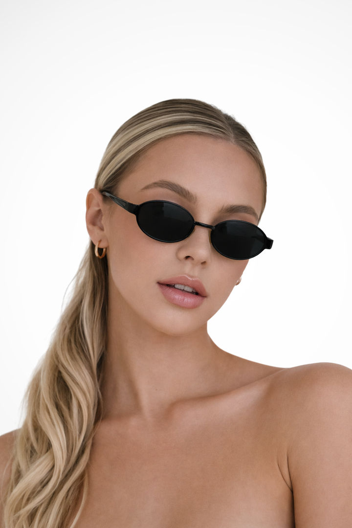 Chic women's oval metal frame sunglasses, a fashionable eyewear accessory for modern style.