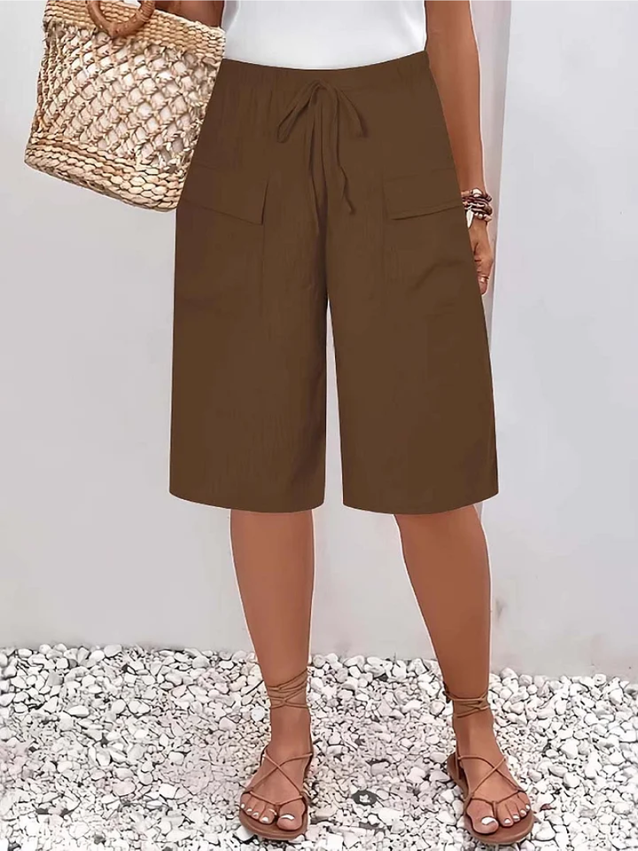 Comfortable women's fashion trousers with an oversize fit and decorative lace trim, great for casual elegance.