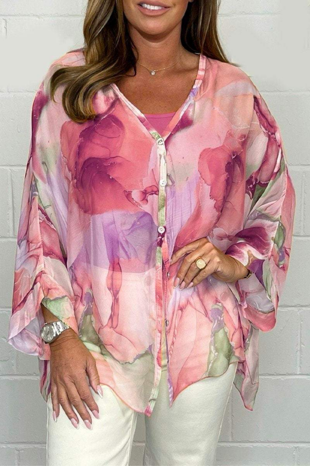 Artistic women's oversized blouse with abstract print, button-down, versatile for casual to elegant style.