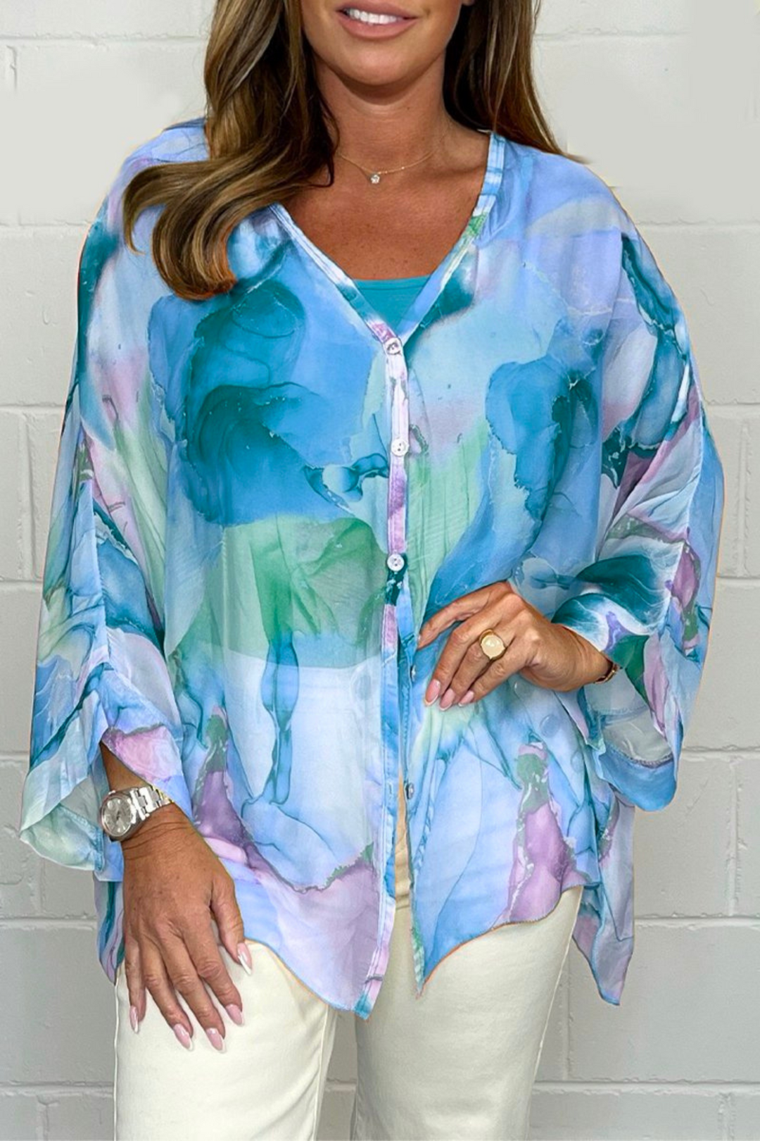 Trendy women's long sleeve oversized blouse featuring a vibrant abstract print; perfect for effortless fashion.