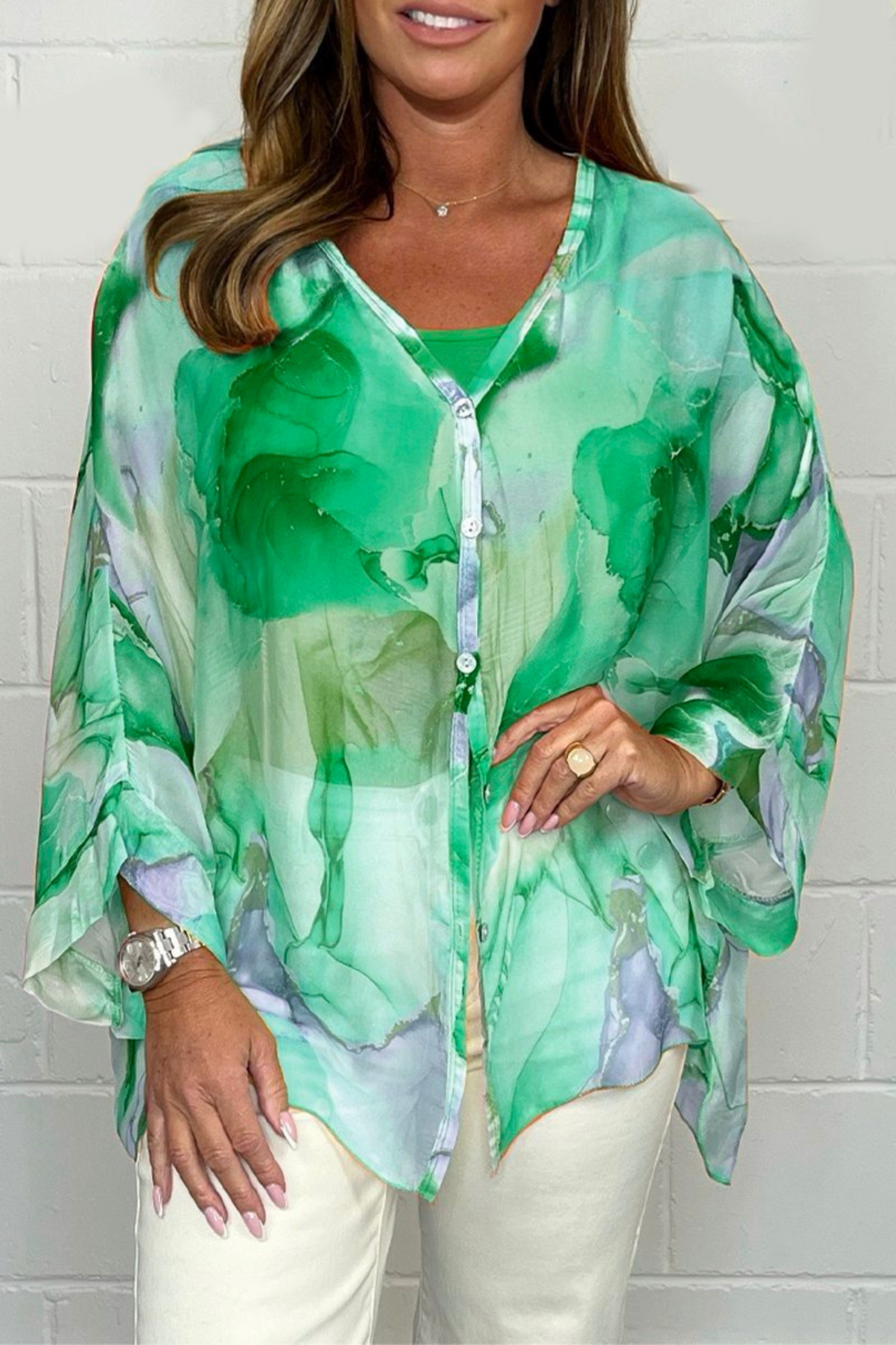 Relaxed fit women's oversized abstract print blouse, v-neck design, long sleeves, a chic and casual top.