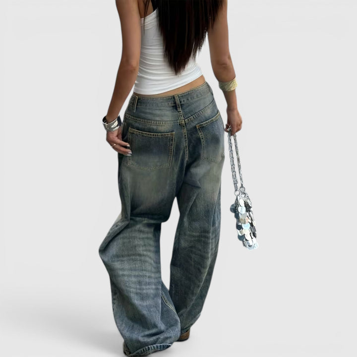 Floor length women's straight leg pants, oversized and baggy, offering a relaxed silhouette.