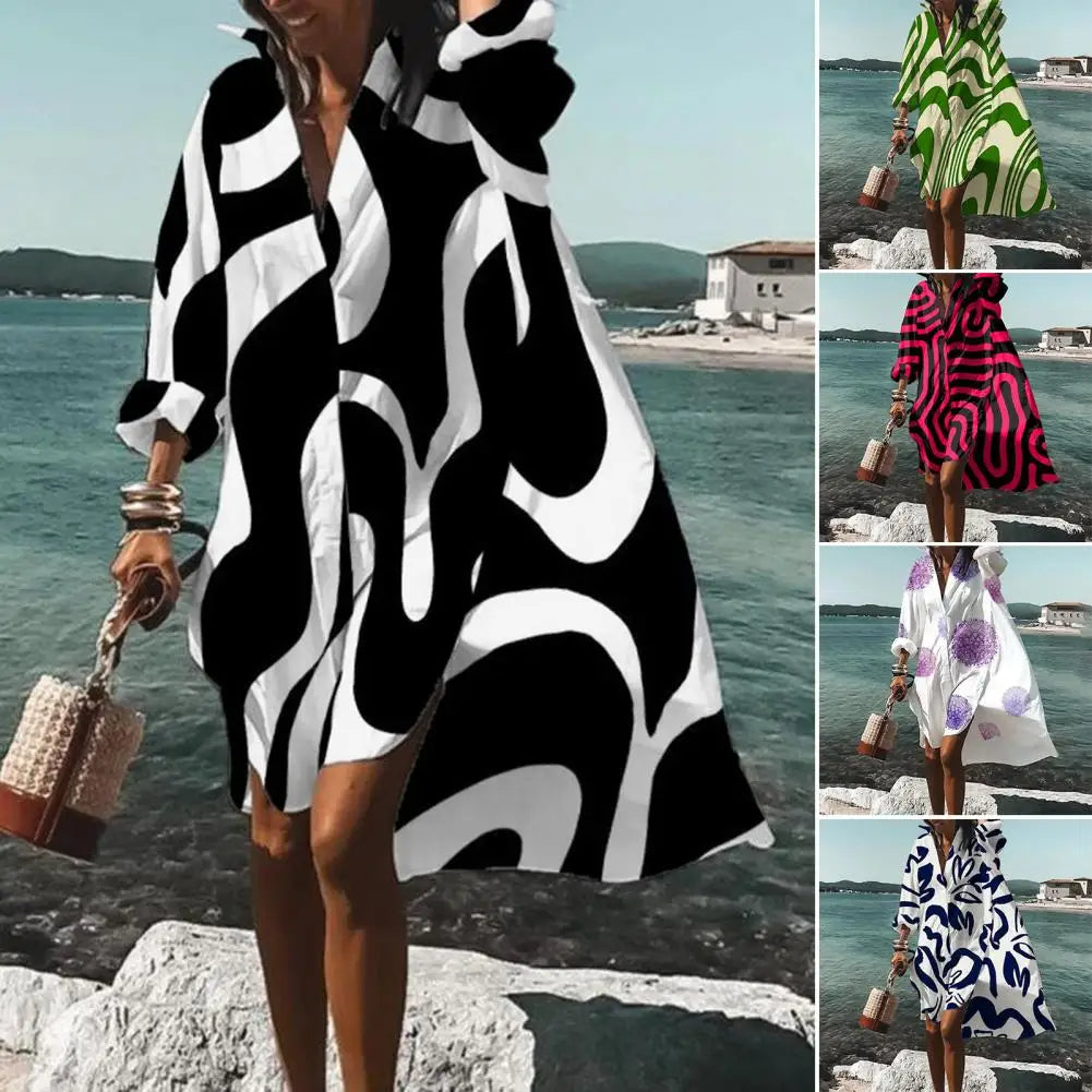 Women's oversized boho summer midi dress with vibrant bohemian print, V-neck, and short sleeves for casual wear.