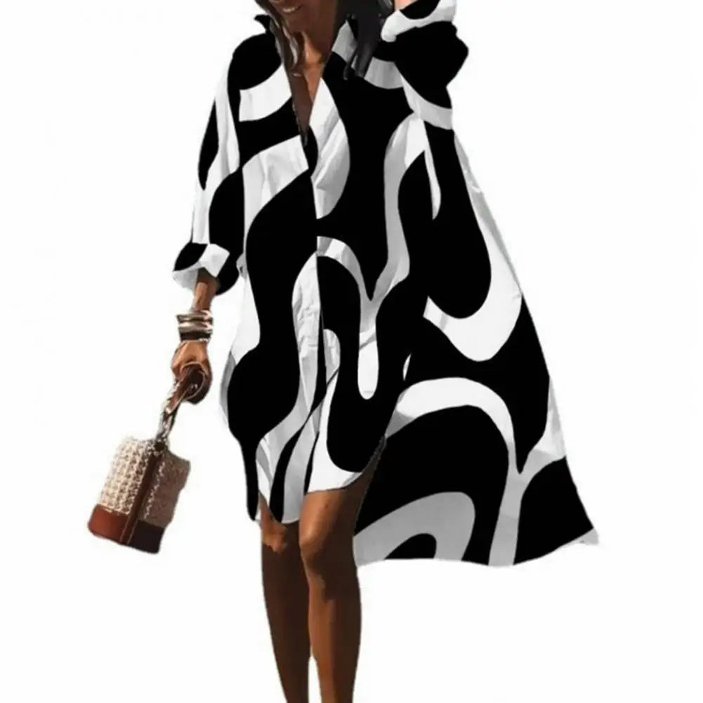 Comfortable women's oversized summer dress with a flowy boho print, V-neck, and short sleeves for effortless style.