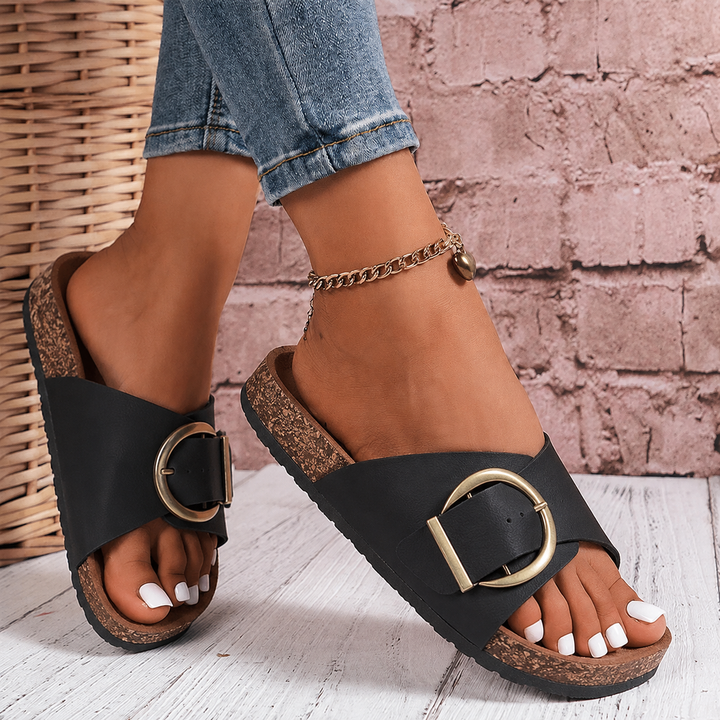 Chic women's oversized buckle slide sandals. Essential casual summer footwear, offering comfort & effortless vacation style.