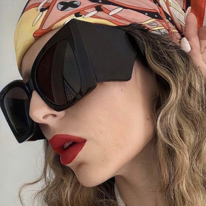 Women's oversized cat-eye sunglasses, UV protection, stylish fashion eyewear for summer.