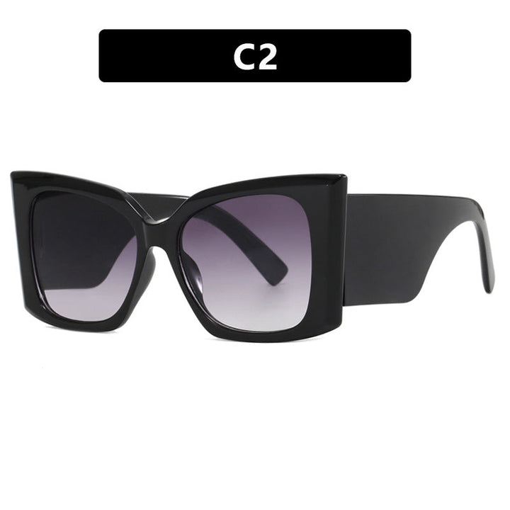 Modern oversized cat-eye sunglasses for women, chic UV protection fashion eyewear.