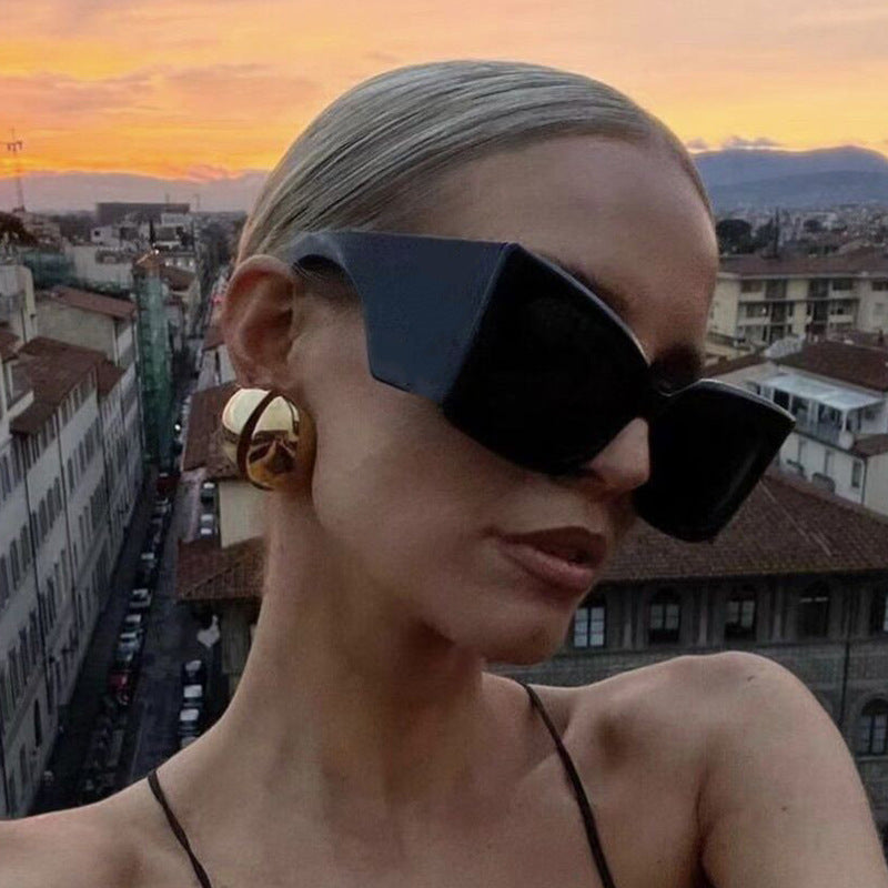 Chic ladies' oversized cat-eye sunglasses, glamorous UV protected fashion accessory for women.