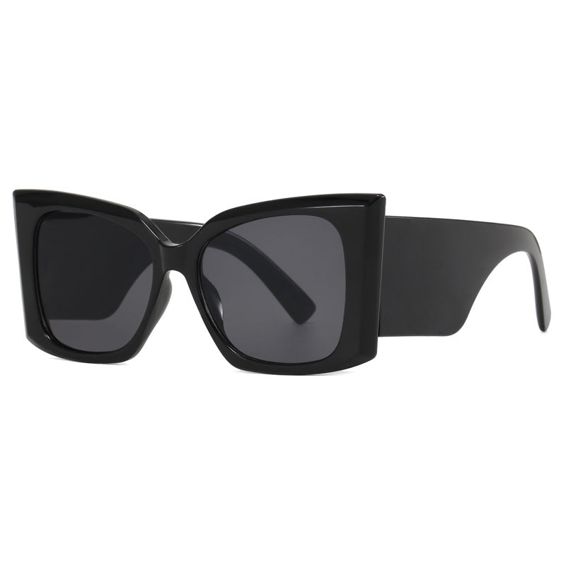 Stylish women's cat-eye sunglasses with an oversized plastic frame, full UV protection eyewear.