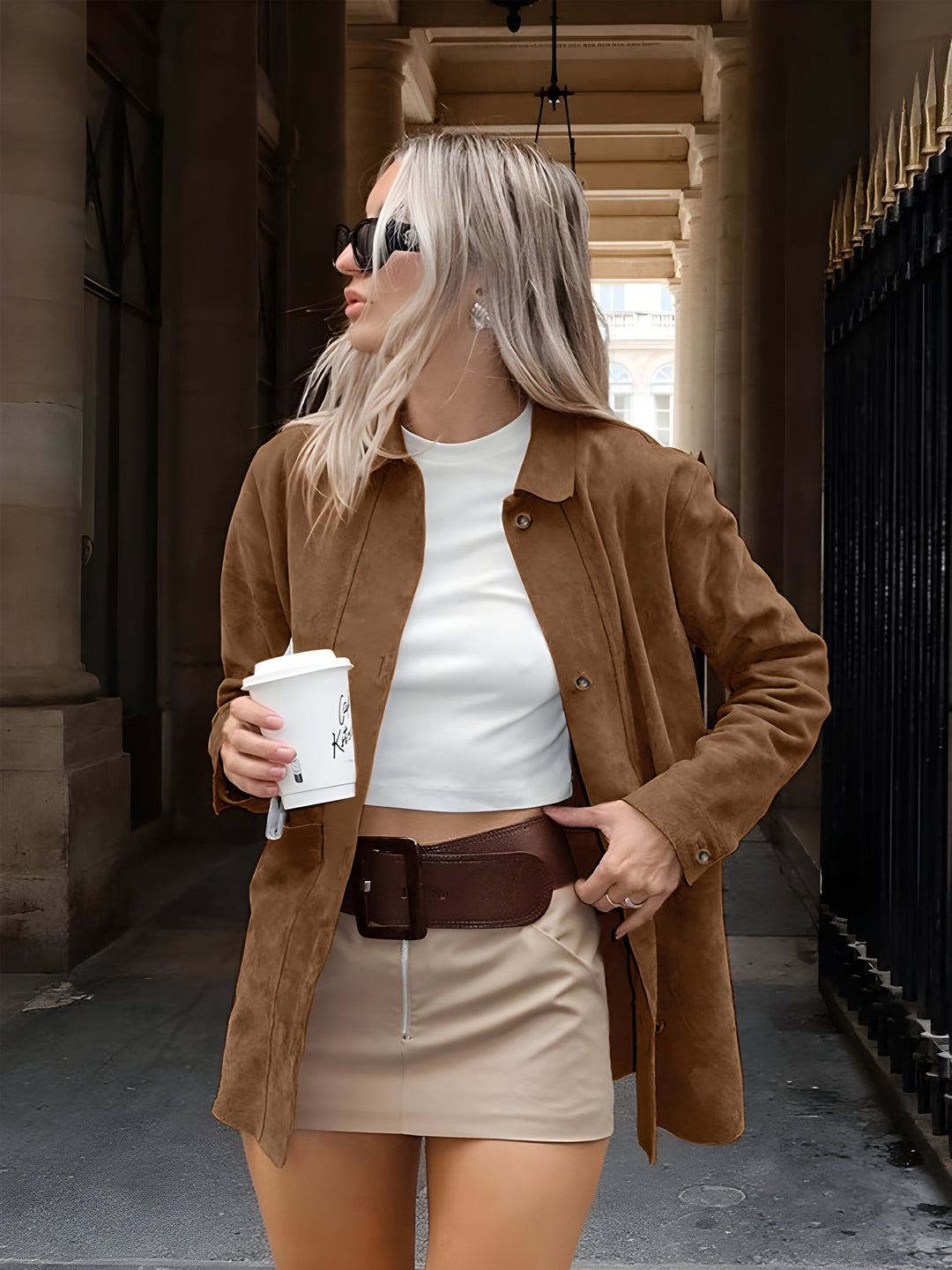Trendy women's oversized coffee brown jacket. Stylish button-down outerwear offering comfort for casual fashion.