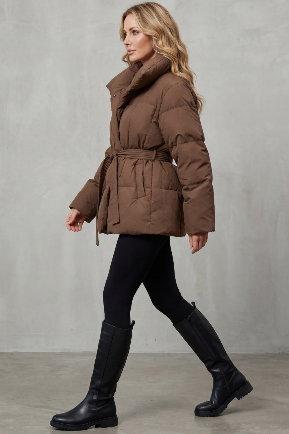 Modern women's elegant puffer coat with an oversized collar, a chic & warm winter fashion statement.