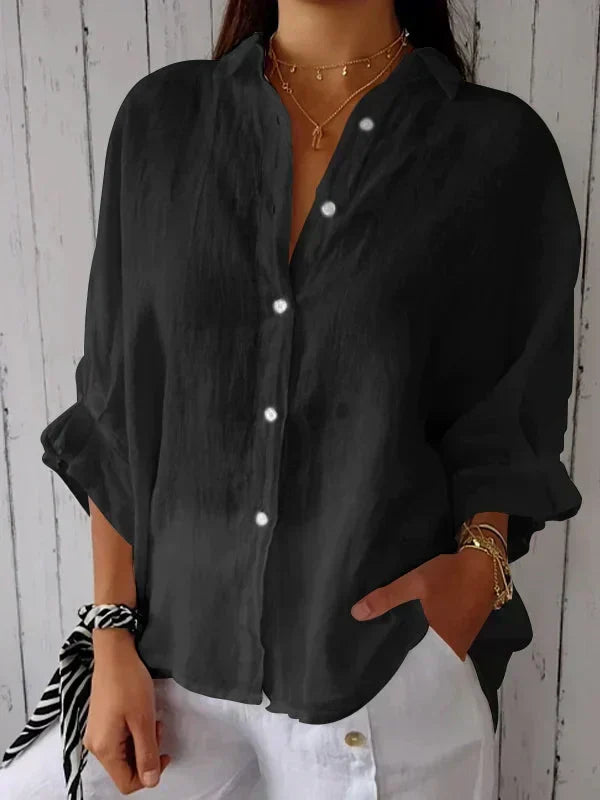 Women's oversized collared button-front long sleeve shirt. Relaxed fit, perfect for casual everyday wear.