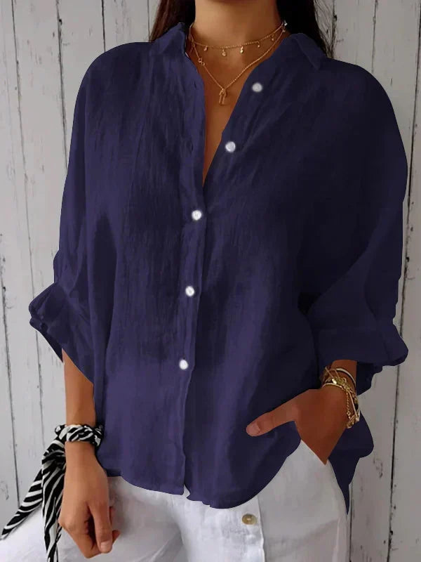 Relaxed fit women's oversized long sleeve shirt with button-front. Comfortable collared top for casual style.
