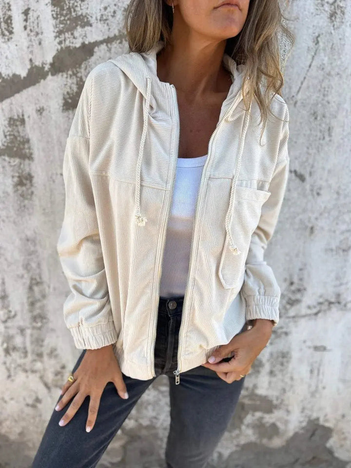 Stylish women's oversized corduroy hooded zip jacket, quilted design offers casual comfort & everyday fashion.