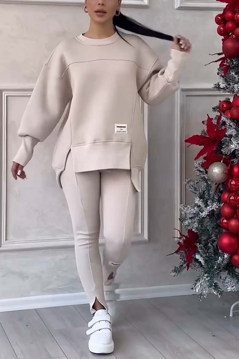 Women's oversized crew neck long sleeve loungewear set. Relaxed fit, comfortable two-piece for stylish casual wear.