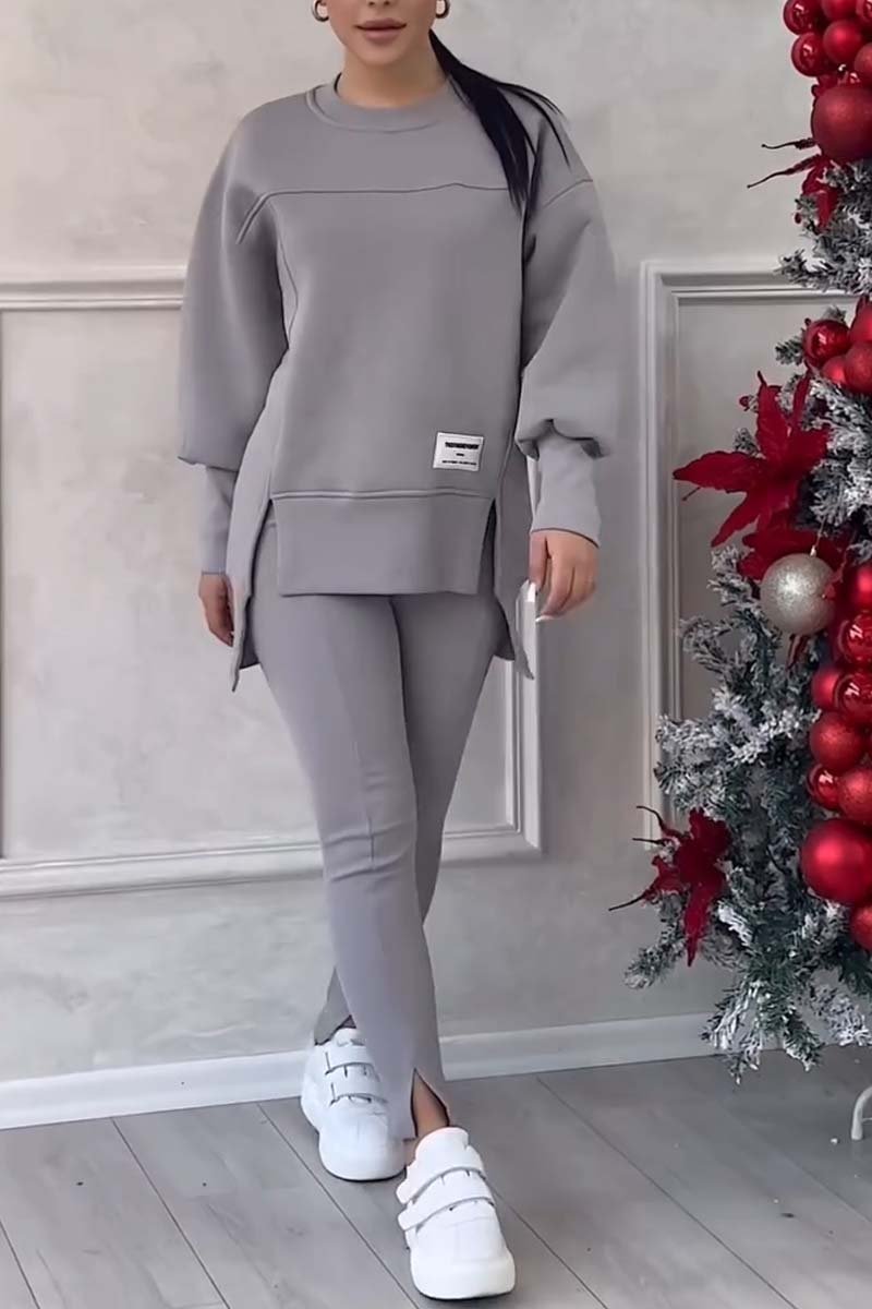 Cozy women's oversized loungewear set with soft fabric. Long sleeve crew neck top & comfortable bottoms for autumn.