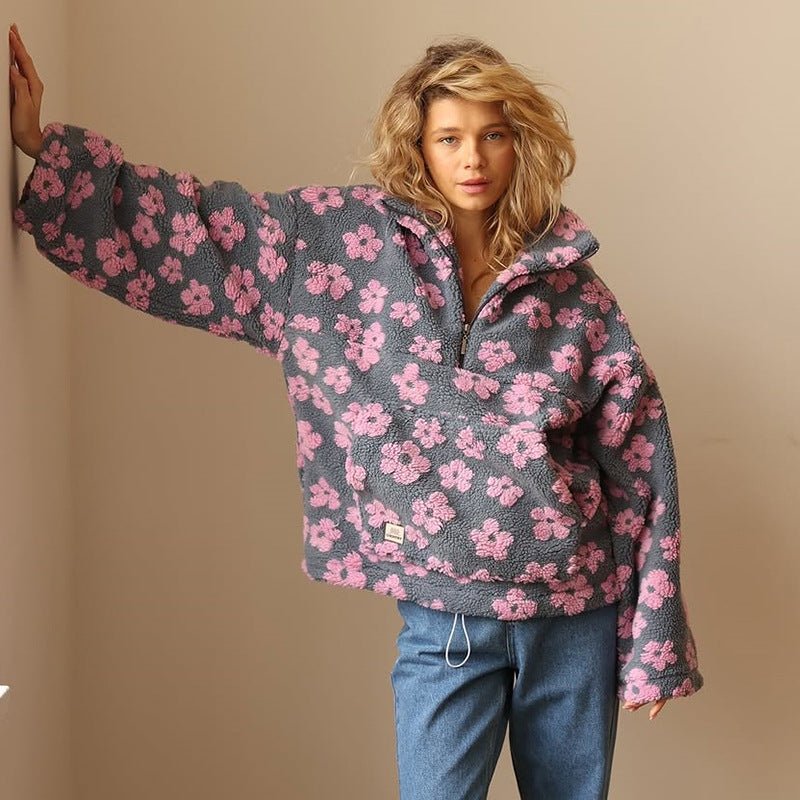 Cozy women's floral print half-zip sweater jacket. Oversized design, ideal for casual layering.