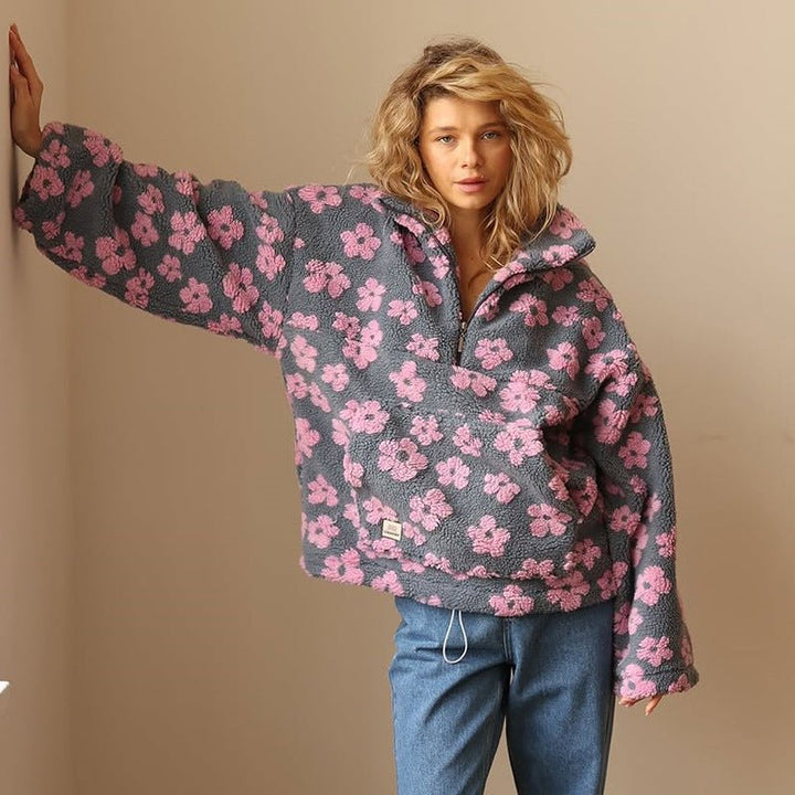 Cozy women's floral print half-zip sweater jacket. Oversized design, ideal for casual layering.