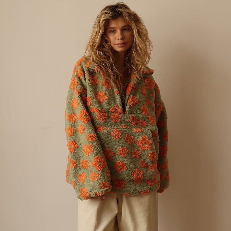 Elegant women's oversized half-zip floral sweater jacket. A stylish, relaxed fit for everyday wear.