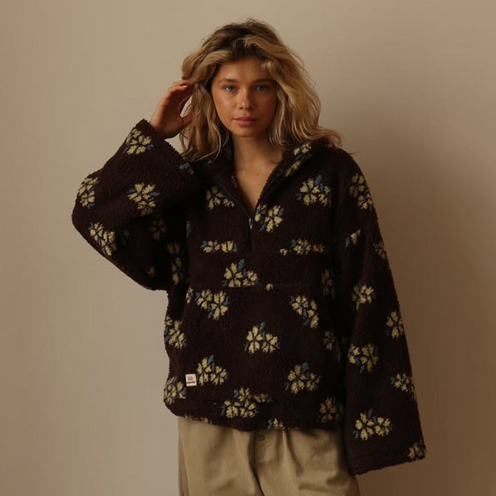 Layering-ready women's oversized floral half-zip sweater jacket. A cozy, hip-length winterwear staple.