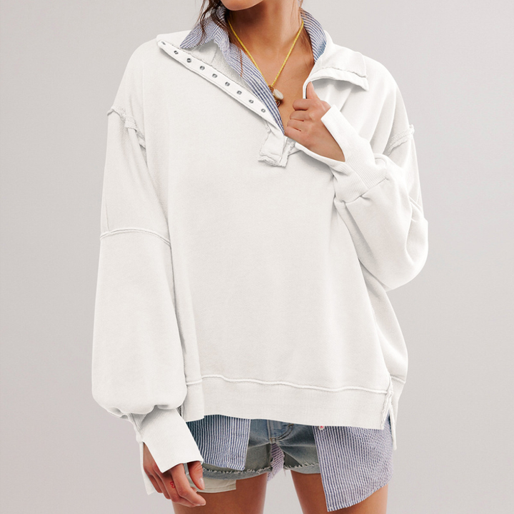 Stylish women's oversized Henley pullover. Comfortable, relaxed fit, long sleeve top for everyday wear.
