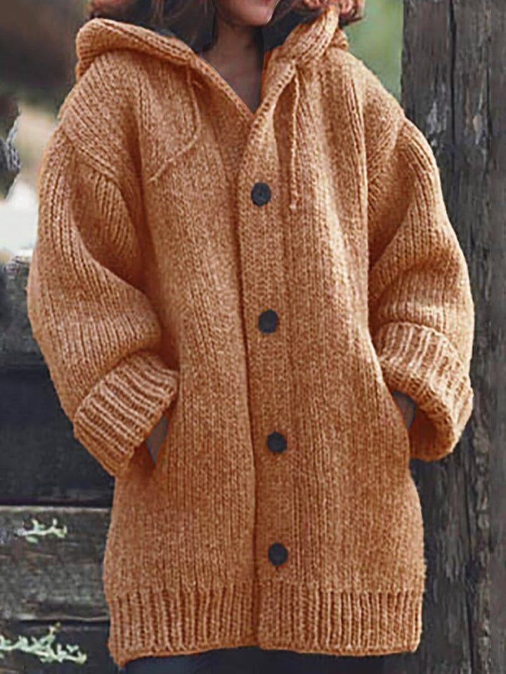 Stylish women's oversized hooded knit cardigan for a chic, cozy, and comfortable fall/winter look.