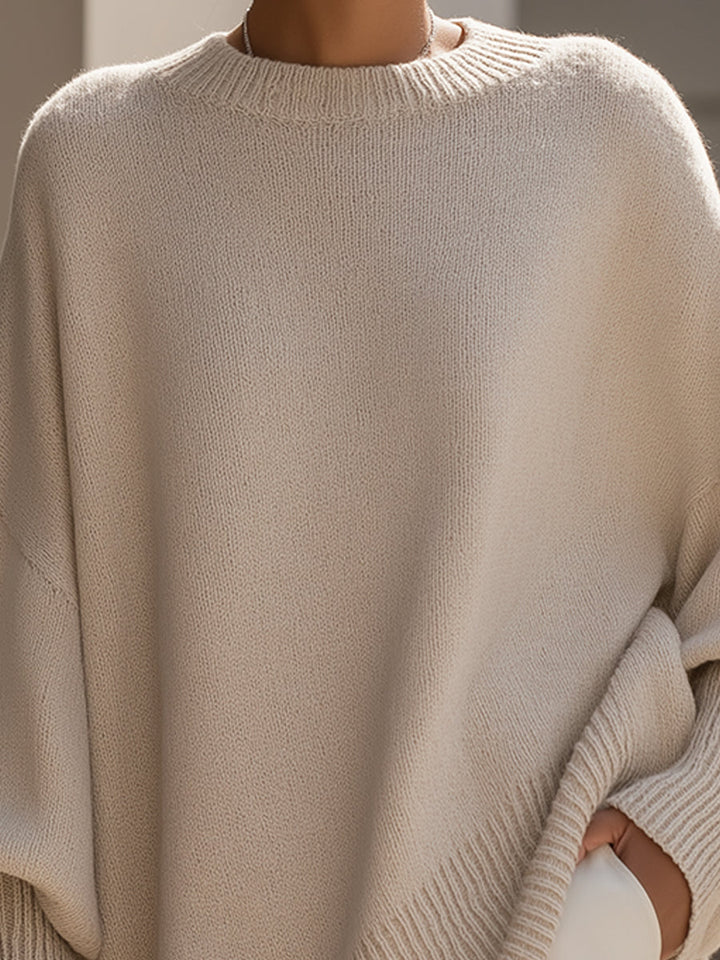 Comfortable women's draped sweater with asymmetrical hem. Perfect for casual everyday style.