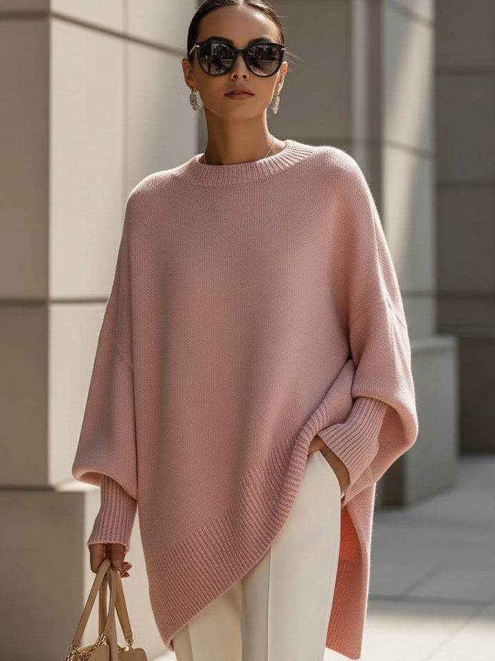 Effortless women's oversized knit top, casual & modern. Draped long sleeve with asymmetrical hem.
