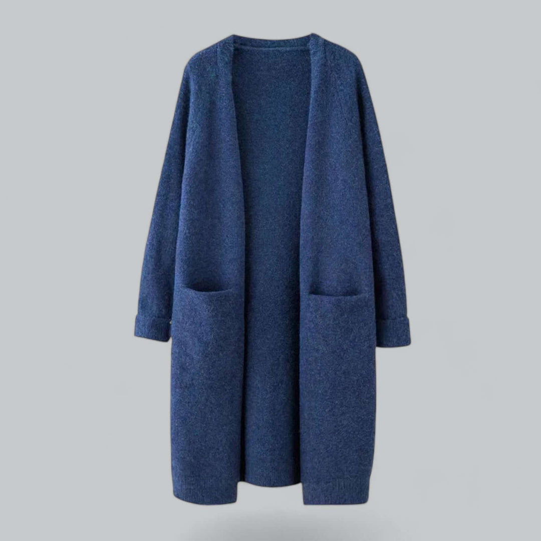 Woman modeling a comfy oversized knitted cardigan, ideal for cozy fall fashion.