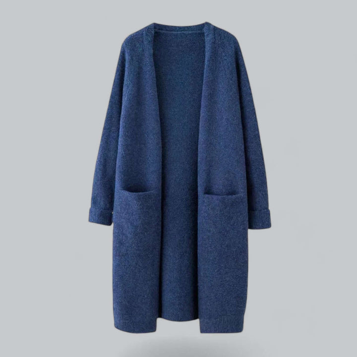 Woman modeling a comfy oversized knitted cardigan, ideal for cozy fall fashion.