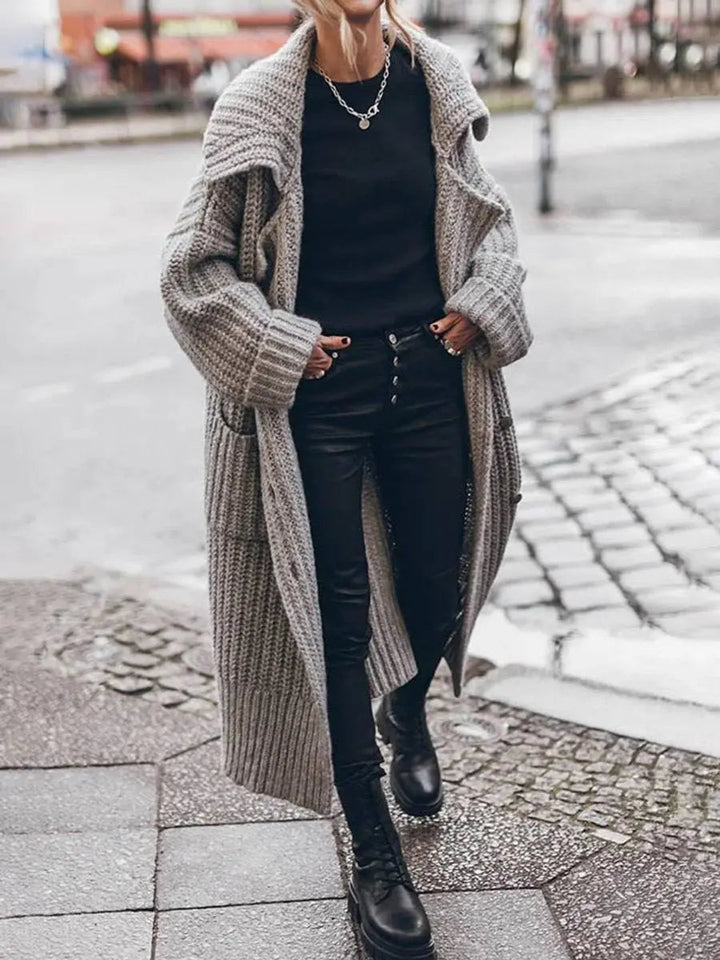 Cozy women's oversized longline cardigan with a stylish lapel, ideal for casual chic winter outfits.